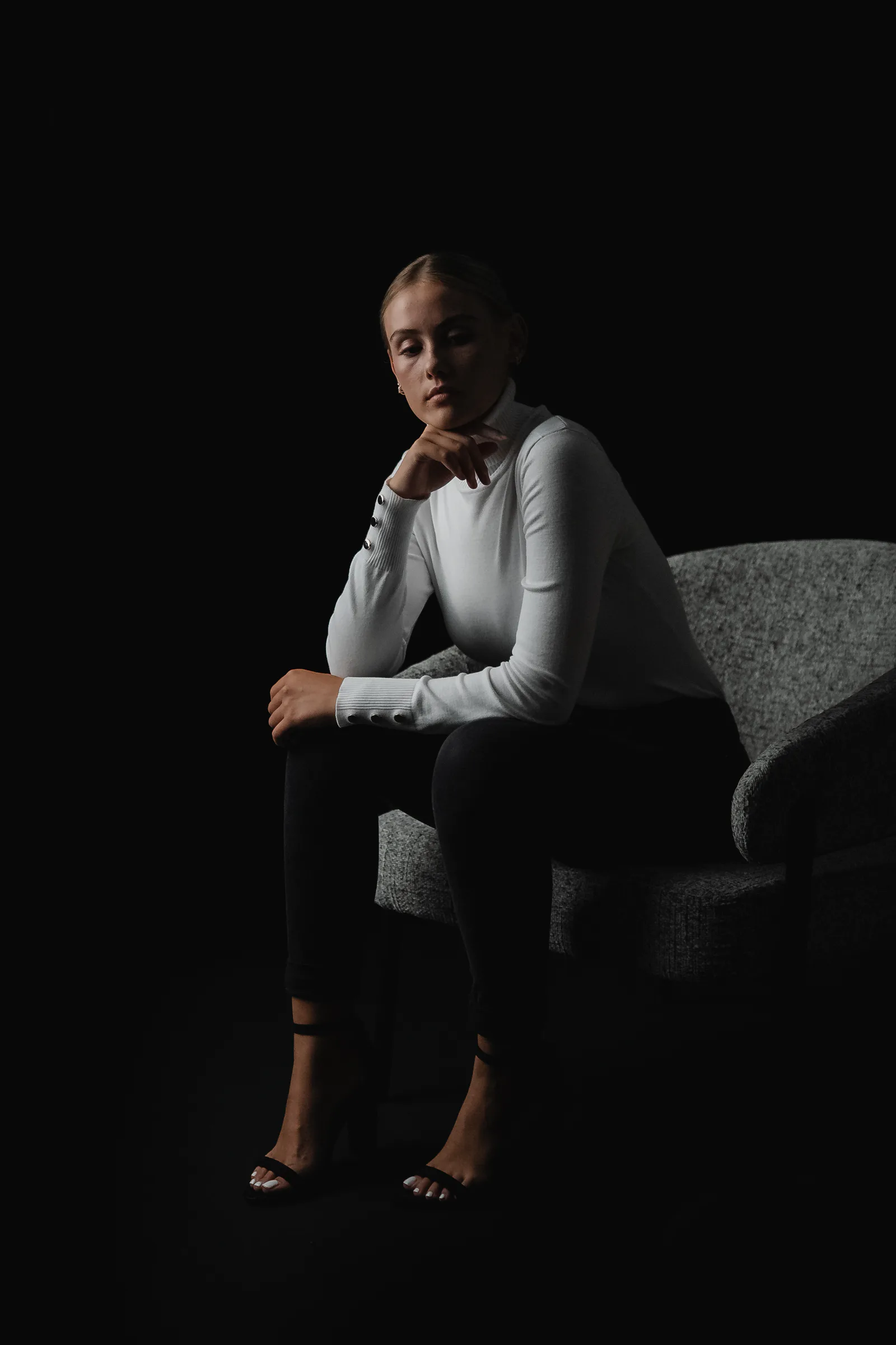 Seated portrait photographed at Studio GQ