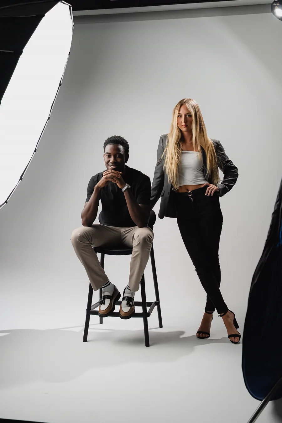 Two models posing on the Studio GQ cyclorama